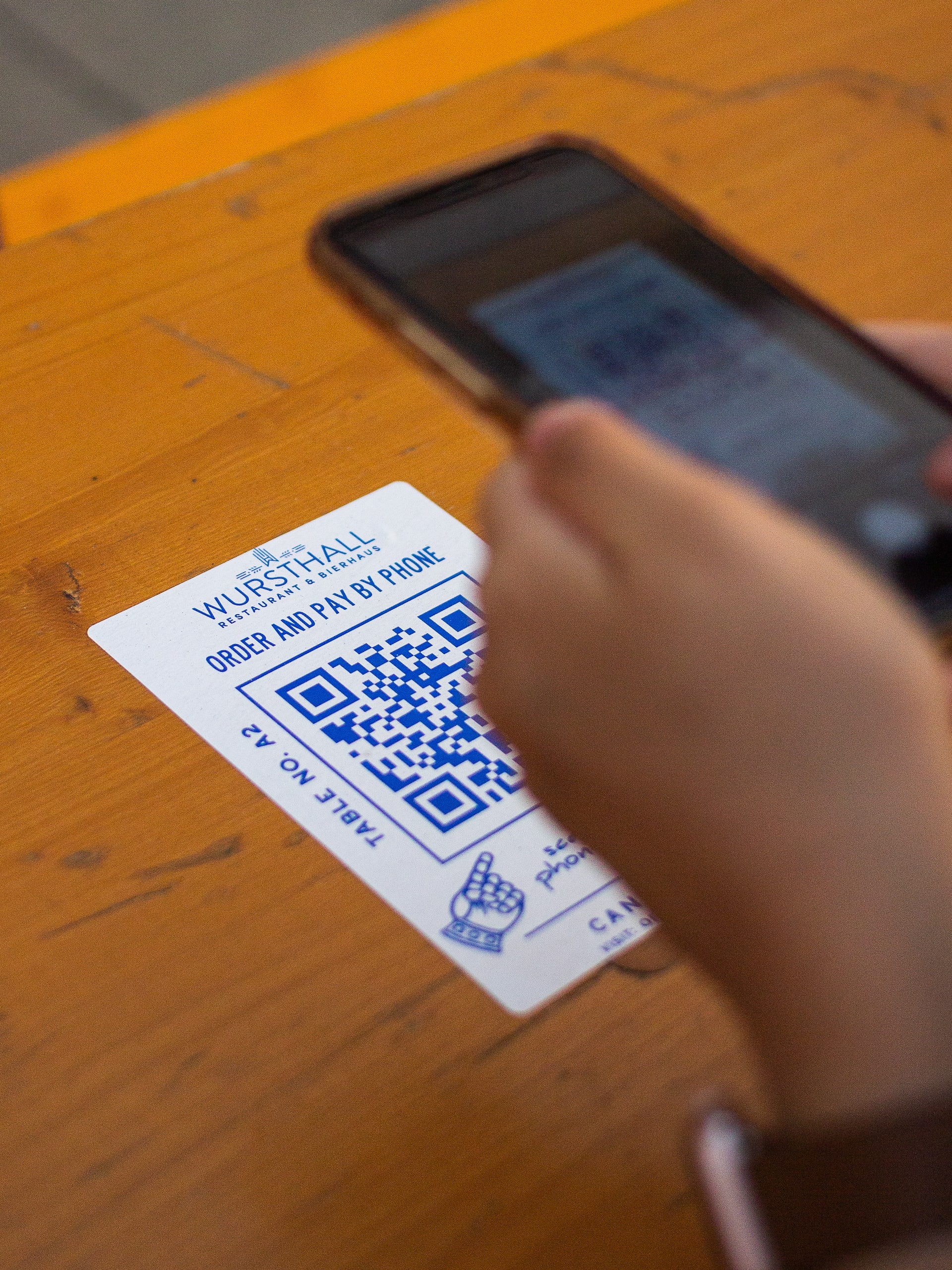 Somebody scanning a QR code